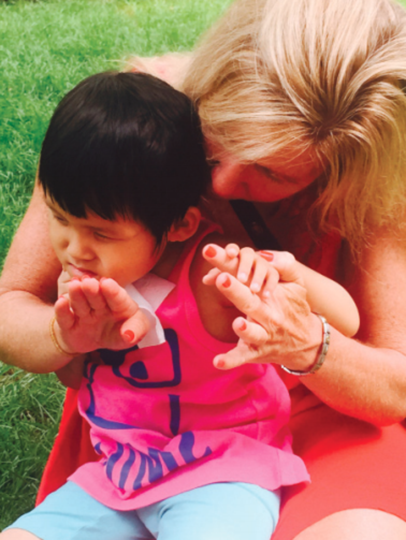 Visually impaired girls receives assistant from mother
